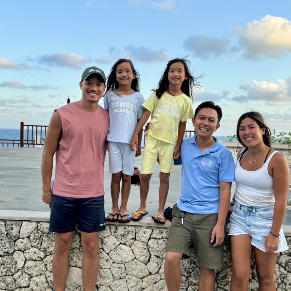 A family of guests on a coastal sightseeing tour in Bali