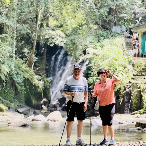 Guests at a waterfall on a Bali day tour